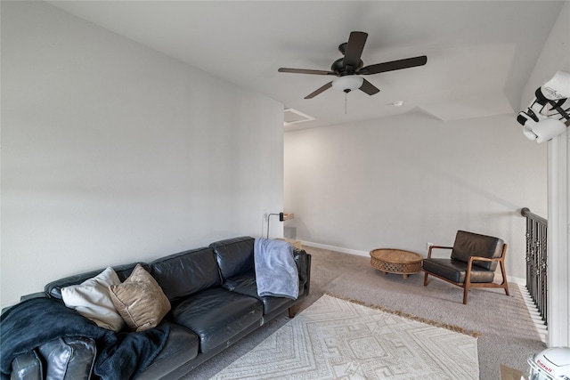 carpeted living room featuring ceiling fan