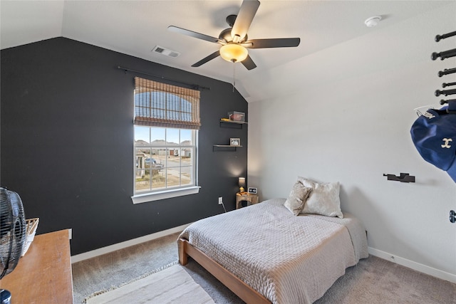 bedroom featuring lofted ceiling, light carpet, and ceiling fan