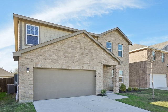 view of front of home with a garage, central AC unit, and a front yard