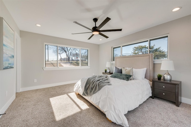 bedroom with light carpet and ceiling fan