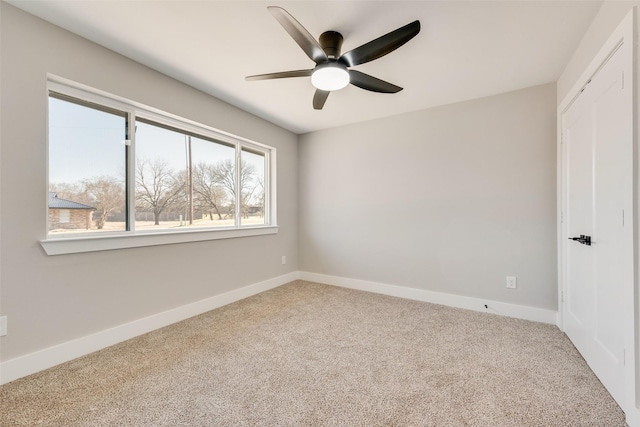 carpeted empty room with ceiling fan