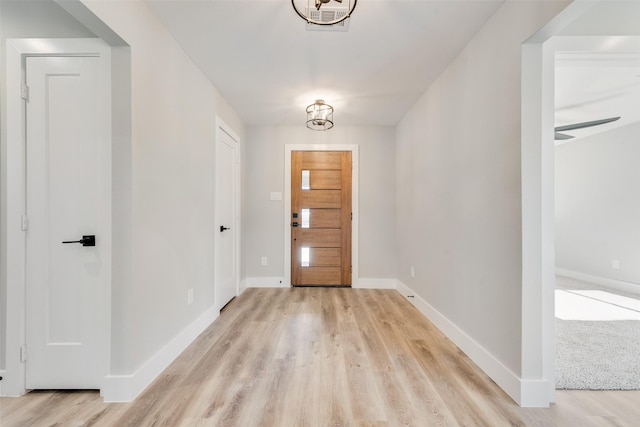 foyer with light wood-type flooring