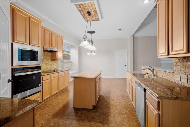 kitchen with a kitchen island, decorative light fixtures, built in microwave, sink, and oven