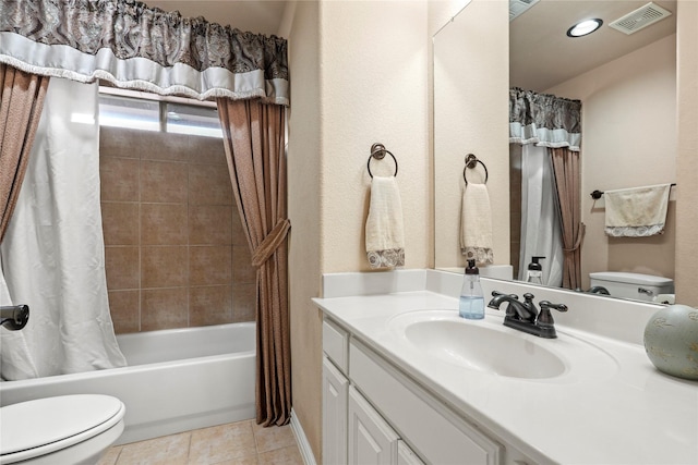 full bathroom featuring vanity, tile patterned floors, shower / bath combination with curtain, and toilet