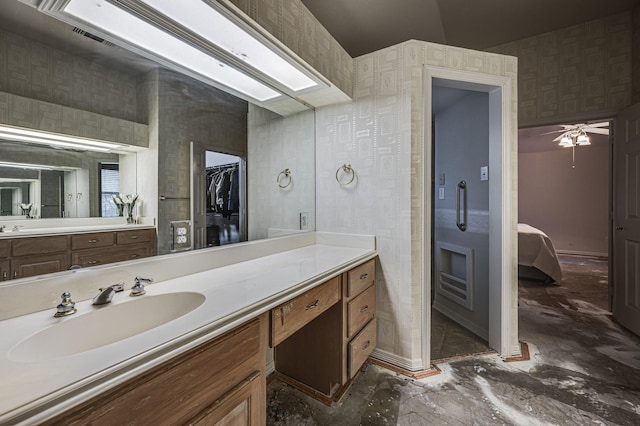 bathroom with vanity and a skylight