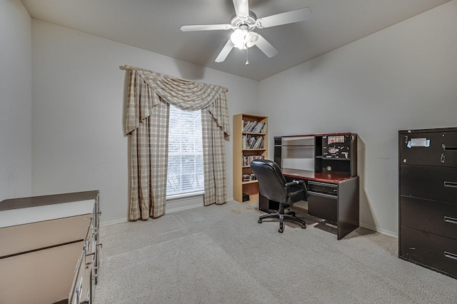 carpeted office space with ceiling fan