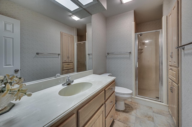 bathroom featuring vanity, walk in shower, and toilet