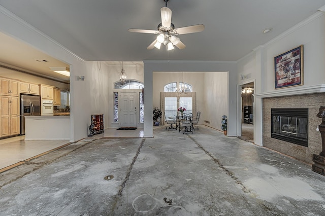 interior space featuring crown molding, a high end fireplace, and a notable chandelier