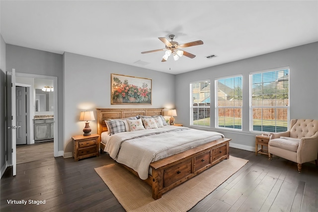 bedroom with dark hardwood / wood-style floors and ceiling fan