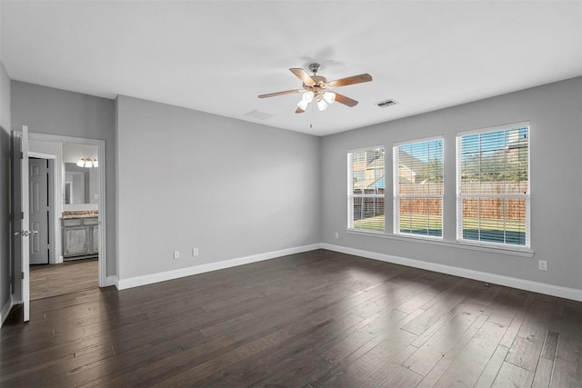 unfurnished room with ceiling fan and dark hardwood / wood-style floors