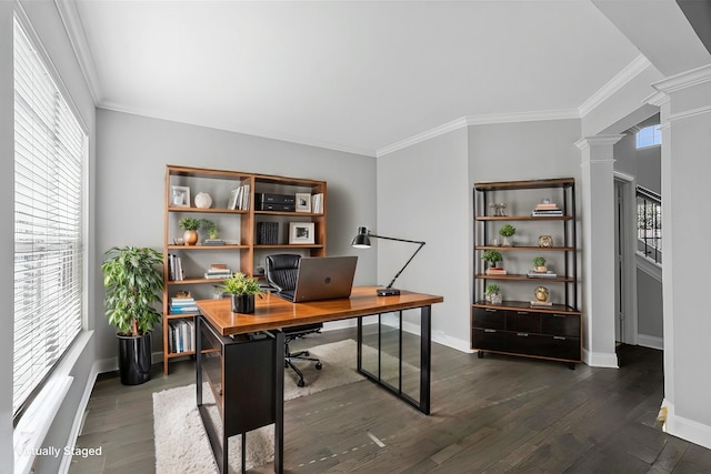 office space with crown molding, dark wood-type flooring, and decorative columns