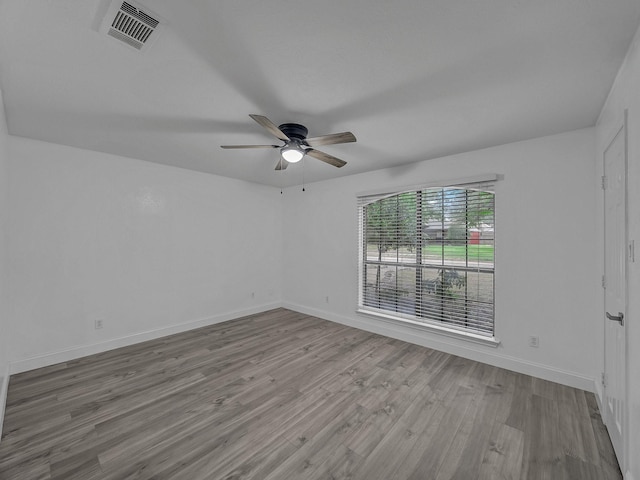 spare room with ceiling fan and light hardwood / wood-style floors