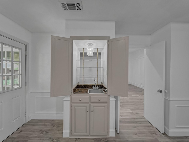 bathroom with hardwood / wood-style flooring and sink