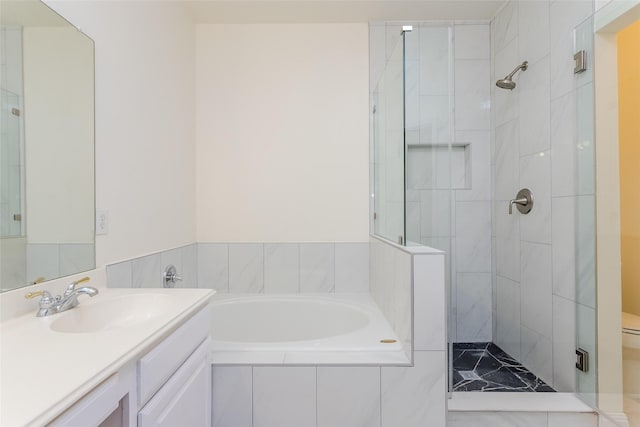 bathroom featuring vanity and plus walk in shower