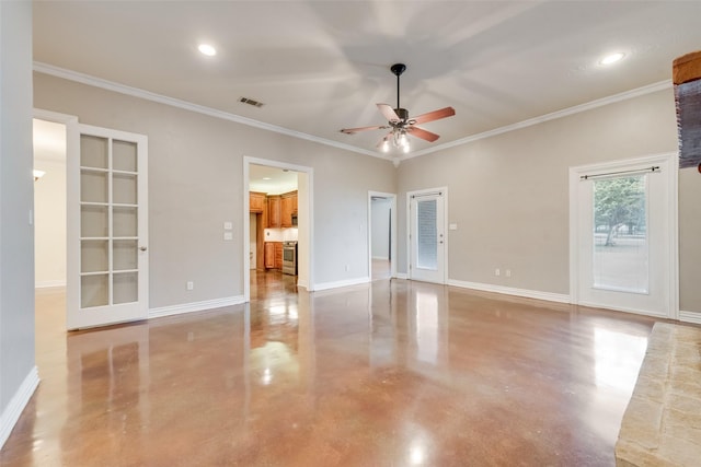 spare room featuring crown molding, ceiling fan, and concrete floors