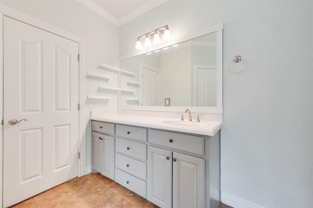 bathroom with ornamental molding, vanity, and tile patterned floors