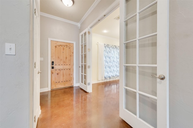 foyer featuring crown molding, concrete floors, and french doors