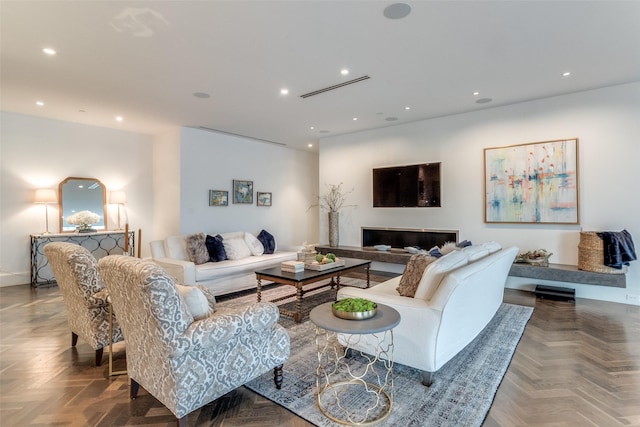 living room featuring parquet flooring