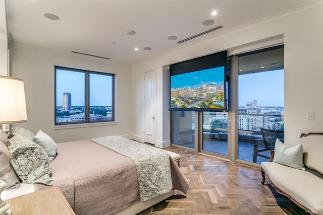 bedroom with ornamental molding, parquet flooring, and access to outside