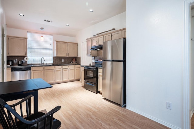 kitchen with sink, light brown cabinets, pendant lighting, stainless steel appliances, and backsplash