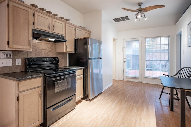 kitchen with light brown cabinetry, stainless steel fridge, decorative backsplash, black range with electric cooktop, and light hardwood / wood-style flooring