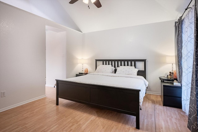 bedroom featuring vaulted ceiling, light hardwood / wood-style floors, and ceiling fan