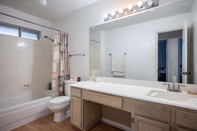 full bathroom with shower / tub combo with curtain, vanity, wood-type flooring, and toilet