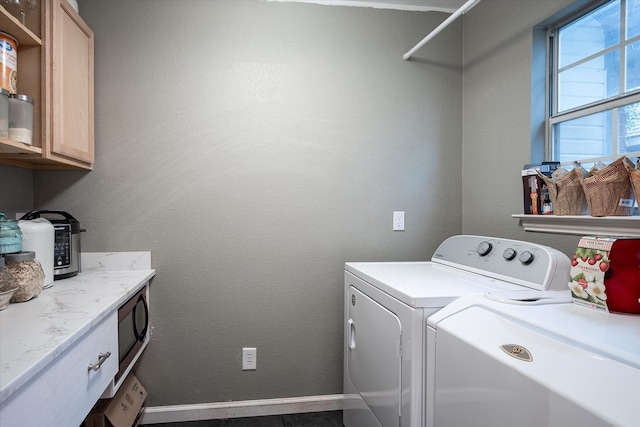 laundry area with cabinets and washer and dryer