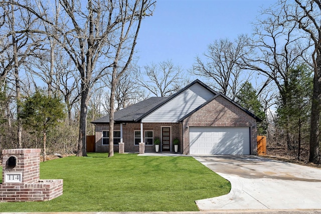 view of front of property featuring a garage and a front yard