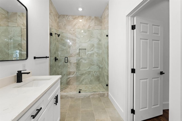 bathroom featuring vanity and an enclosed shower