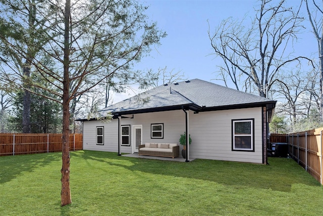 rear view of property with an outdoor living space, a yard, and a patio area