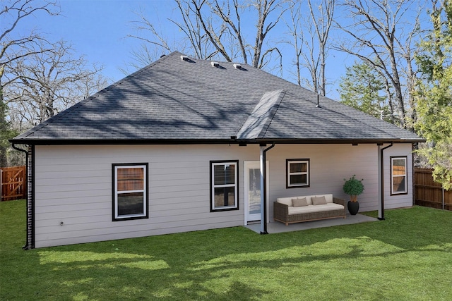 rear view of house featuring a yard, outdoor lounge area, and a patio