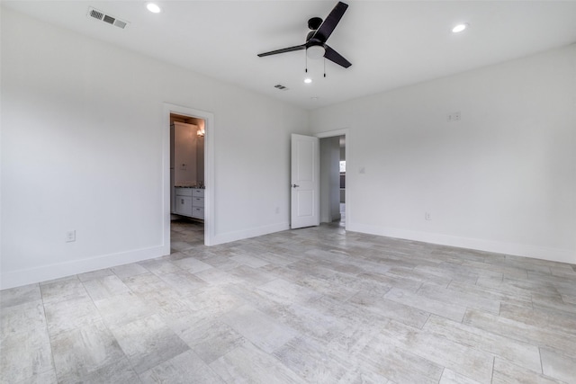 unfurnished bedroom with ensuite bathroom, recessed lighting, visible vents, and baseboards