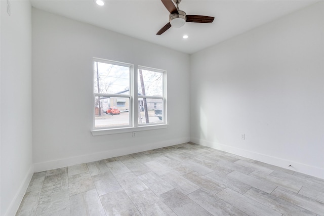 spare room featuring baseboards, a ceiling fan, and recessed lighting