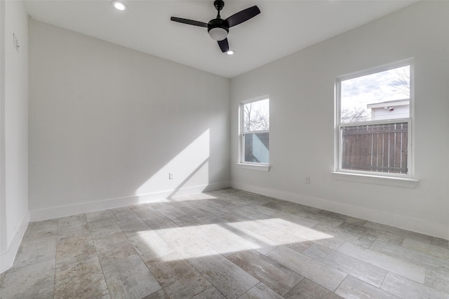 unfurnished room featuring recessed lighting, ceiling fan, and baseboards