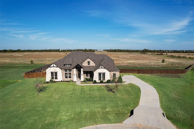 view of front of house featuring a rural view and a front yard