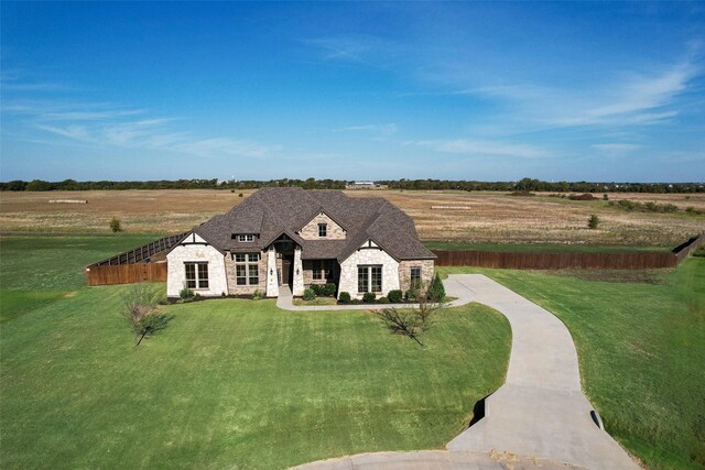 521 Evening Fire Dr, Waxahachie, TX 75167 - french country home with stone siding and a front yard
