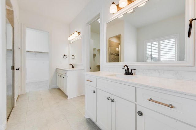 bathroom with vanity and tile patterned floors