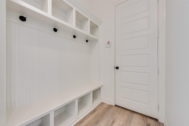 mudroom with light hardwood / wood-style floors