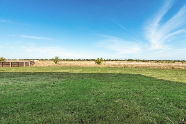 view of yard with a rural view