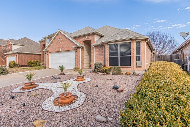 ranch-style house with central AC and a garage