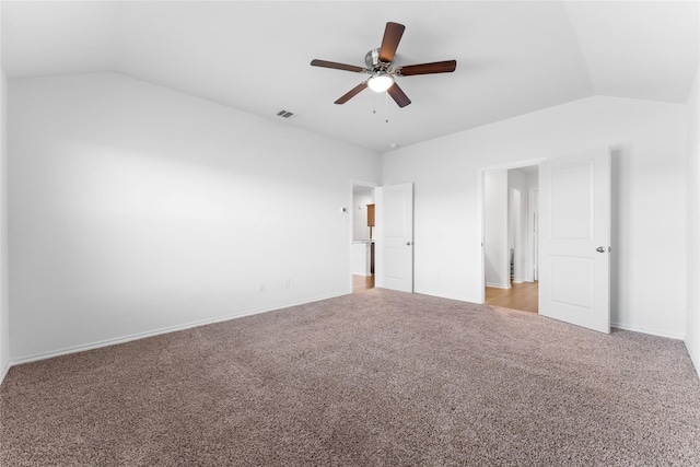 unfurnished bedroom with lofted ceiling, ceiling fan, and carpet flooring