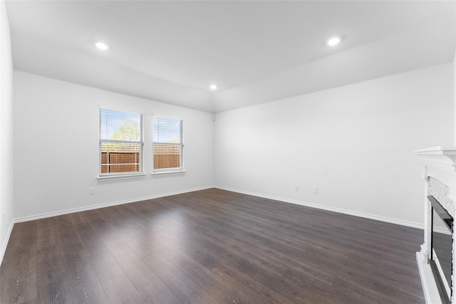 unfurnished living room featuring dark wood-type flooring