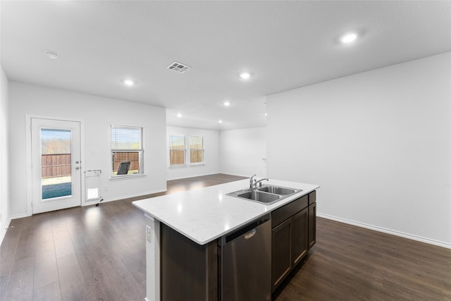 kitchen featuring dishwasher, sink, an island with sink, and dark hardwood / wood-style floors