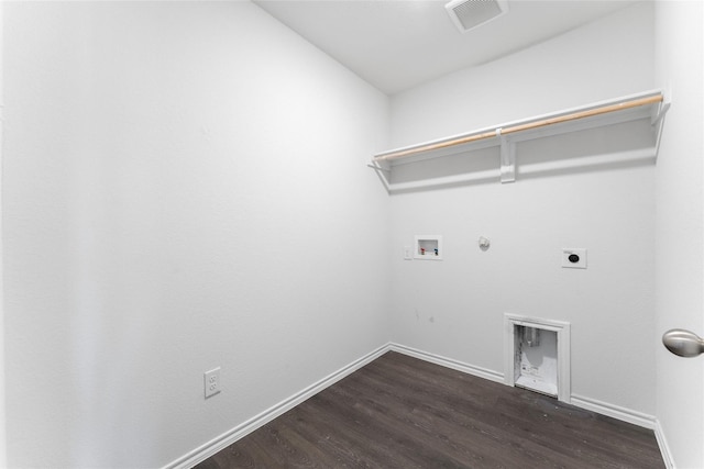 clothes washing area with gas dryer hookup, hookup for an electric dryer, dark hardwood / wood-style flooring, and hookup for a washing machine