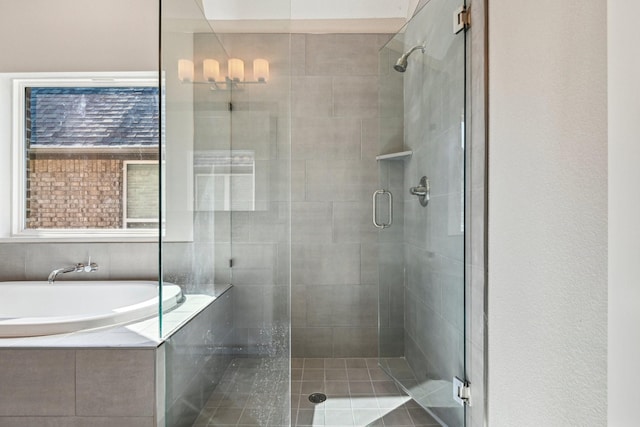 bathroom with shower with separate bathtub