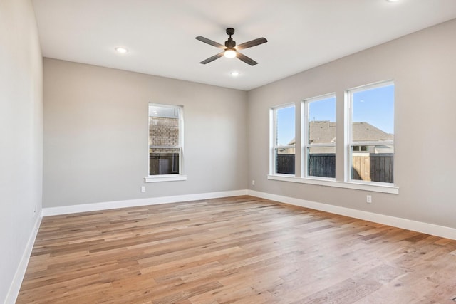 spare room with ceiling fan and light hardwood / wood-style floors