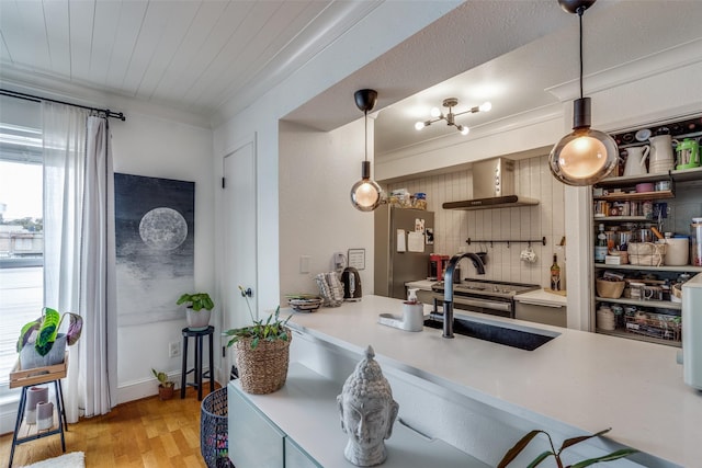 kitchen with sink, stainless steel refrigerator, light hardwood / wood-style floors, decorative backsplash, and wall chimney range hood