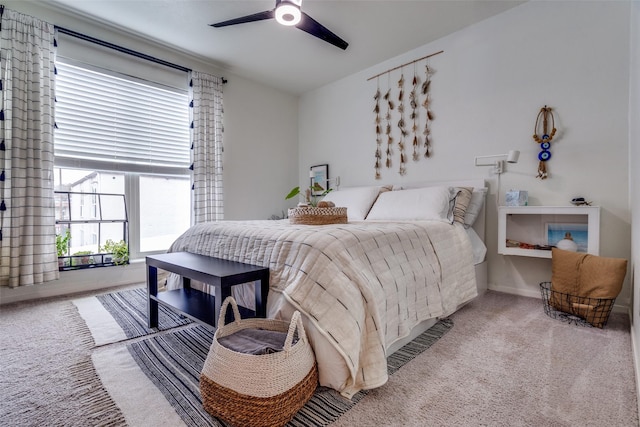 carpeted bedroom featuring lofted ceiling and ceiling fan