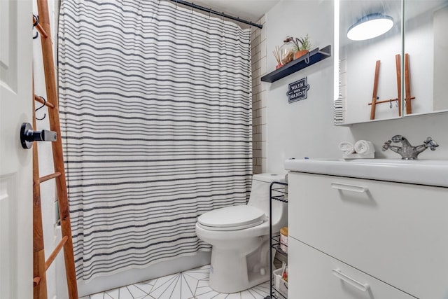 bathroom with tile patterned flooring, vanity, toilet, and walk in shower